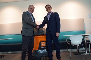 AndrÃ© Vonk (left), co-founder of ECMR, and Henk Toering, Country Director for Diversy Care, shake hands, after a two-year contract was agreed for ECMR to recall and recycle Diversey Care machines at the end of their lives.